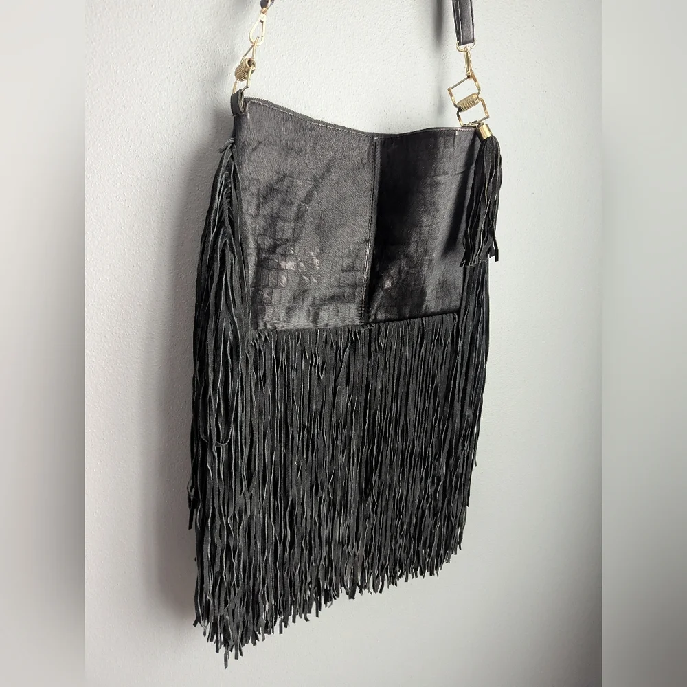 Black leather Fringe crossbody bag feels like cow leather. No tags. No brand tag